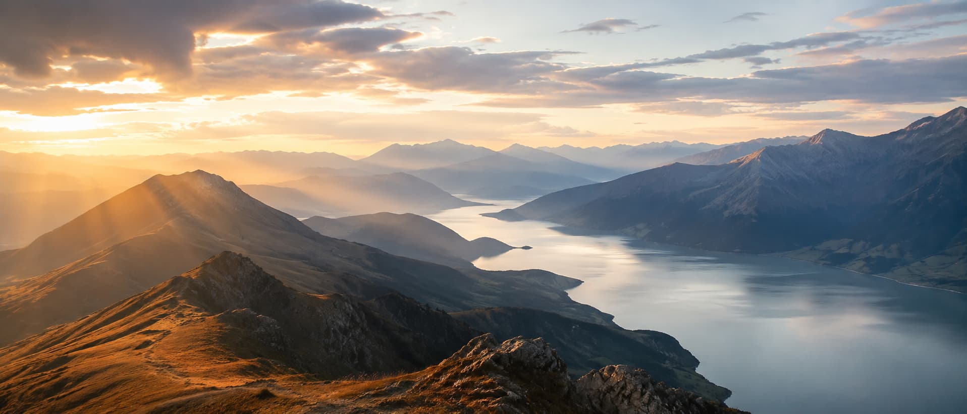 Expansive mountain and lake landscape